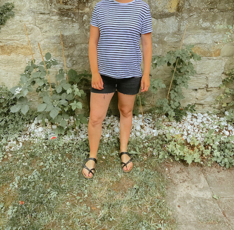 Woman outside in shorts and a t-shirt